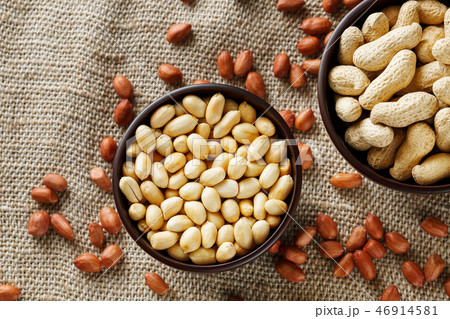 Peanuts in the shell and peeled closeup in a cup Peanuts in the shell and peeled closeup in a cup 46914581