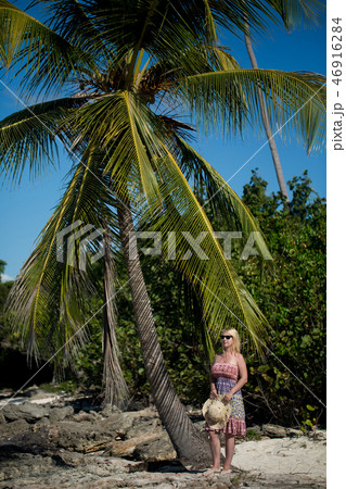 Young sexy blonde woman in beach dress near sea Young sexy blonde woman in beach dress near sea 46916284