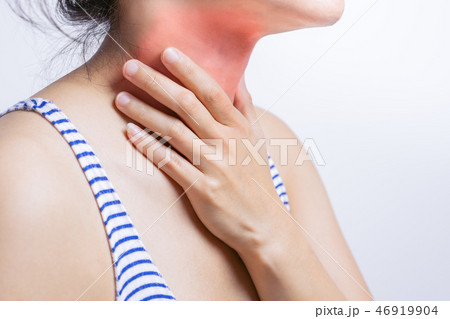Sore throat. Woman touching neck with sore throat 46919904