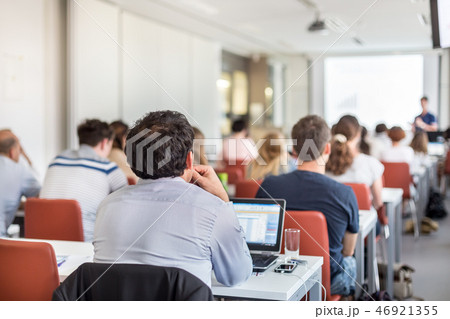 Academic presentation in lecture hall at university. Academic presentation in lecture hall at university. 46921355