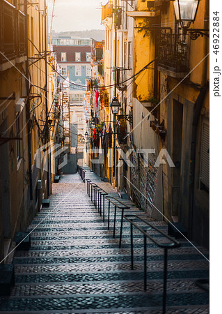 Beautiful Staircase in Lisbon. Hanging laundry in typical narrow street. Sunset in the old downtown 46922884