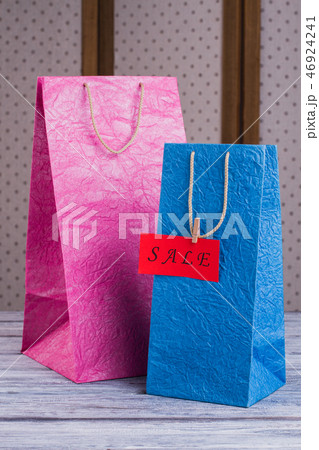 Pink and blue paper shopping bags. Pink and blue paper shopping bags. 46924241