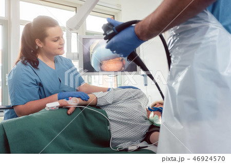 Doctor during endoscopy checking picture of mouth on screen Doctor during endoscopy checking picture of mouth on screen 46924570