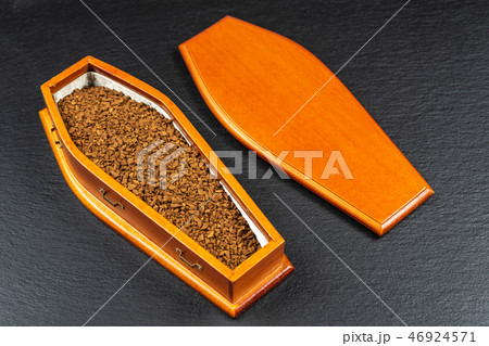 Coffin full of instant coffee.Caffeine kills concept Coffin full of instant coffee.Caffeine kills concept 46924571