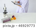 Lab staff write the test results of research 46929773