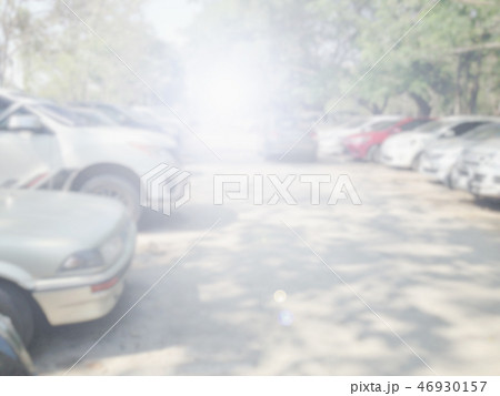 Blured image of cars in parking lot on day time Blured image of cars in parking lot on day time 46930157