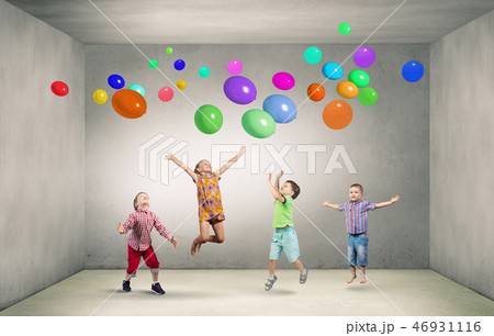 Playful children catch balloons 46931116