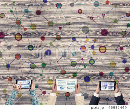 Top view of businesspeople sitting at table and using gadgets 46932449