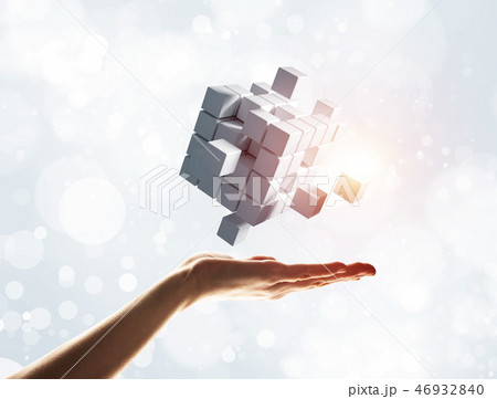 Cube white figure in male palm as symbol for integration. 3D rendering Cube white figure in male palm as symbol for integration. 3D rendering 46932840