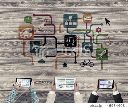 Top view of businesspeople sitting at table and using gadgets 46934408