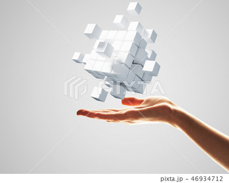 Cube white figure in male palm as symbol for integration. 3D rendering 46934712