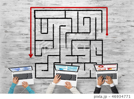 Top view of businesspeople sitting at table and using gadgets Top view of businesspeople sitting at table and using gadgets 46934771