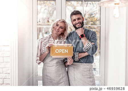 Delighted cheerful young couple smiling to you 46939628
