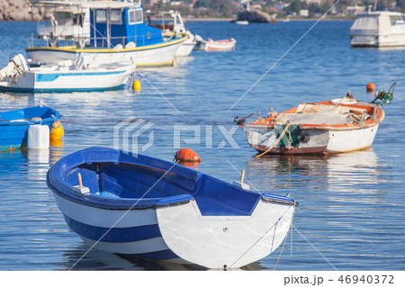 Fishing boats in a harbor in Greece Fishing boats in a harbor in Greece 46940372
