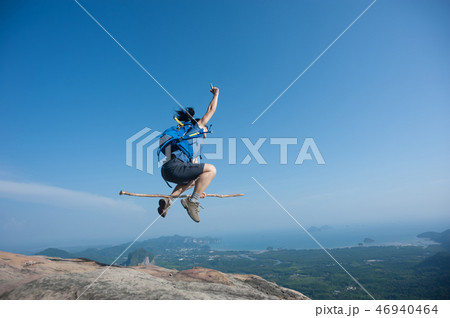 fly with stick on rocky mountain peak fly with stick on rocky mountain peak 46940464