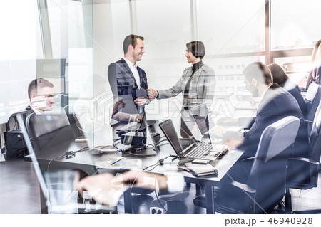 Business people shaking hands in moder corporate office. 46940928