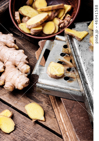 Fresh ginger on rustic background Fresh ginger on rustic background 46941588