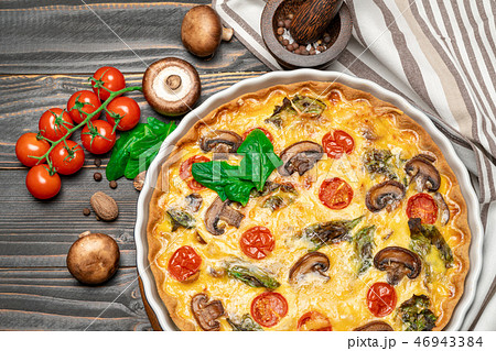 Baked homemade quiche pie in ceramic baking form 46943384