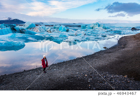 Woman at Jokulsarlon Glacier Lagoon in Iceland 46943467