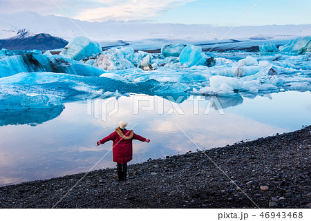 Woman at Jokulsarlon Glacier Lagoon in Iceland 46943468