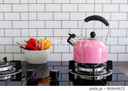 Pink metal kettle in the kitchen 46944623