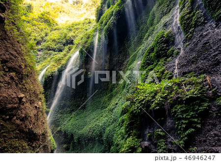 Beautiful Madakaripura waterfall in rocky valley 46946247