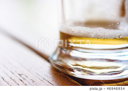 Partially Empty Cold Glass Of Beer With Foam Partially Empty Cold Glass Of Beer With Foam 46946934