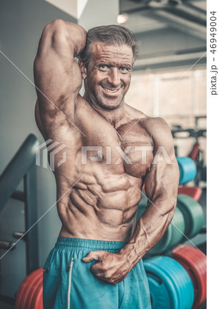 Brutal aged strong bodybuilder athletic men pumping up muscles w Brutal aged strong bodybuilder athletic men pumping up muscles w 46949004