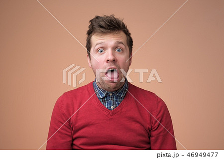Young funny man  gesturing shocked or surprised  46949477