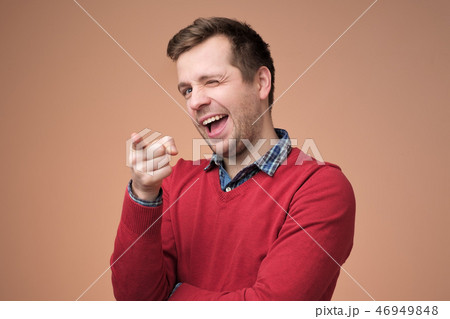 Guy smiling and expressing positive emotions Guy smiling and expressing positive emotions 46949848