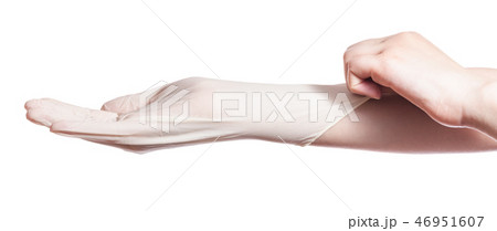 profile view of hand wears latex glove on hand profile view of hand wears latex glove on hand 46951607