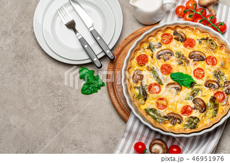 Baked homemade quiche pie in ceramic baking form Baked homemade quiche pie in ceramic baking form 46951976