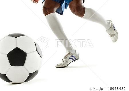 legs of soccer player close-up isolated on white 46953482