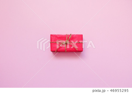 Red gift box on pink background.  46955295