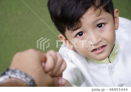 Asian student boy hold father's hand go to school. 46955444