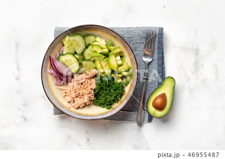 A bowl with tuna fish and avocado salad 46955487