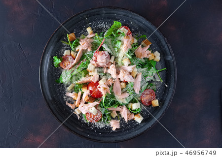 Smoked salmon salad sprinkled with grated cheese Smoked salmon salad sprinkled with grated cheese 46956749