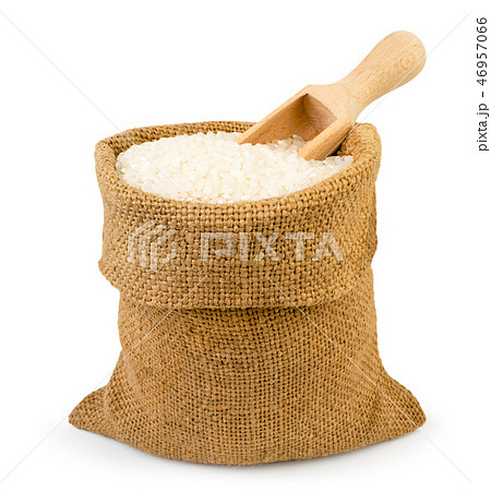 Bag of rice and wooden spoon on a white, isolated. 46957066