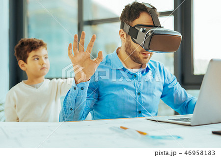 Young engineer being too busy and stopping his son Young engineer being too busy and stopping his son 46958183