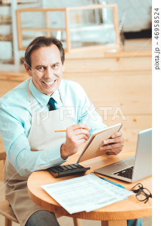 Hardworking owner creating new marketing strategy Hardworking owner creating new marketing strategy 46958524