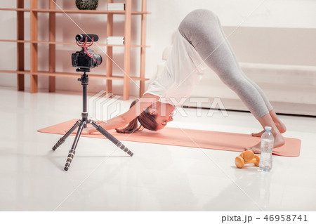 Trained lady making an exercise on the floor 46958741