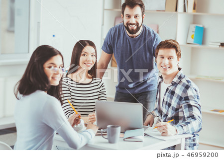 Pleasant joyful students looking at you Pleasant joyful students looking at you 46959200