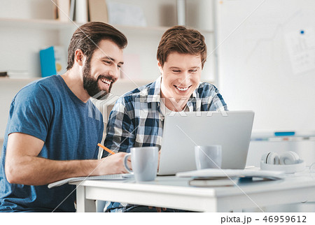Two postgraduates watching educational video Two postgraduates watching educational video 46959612
