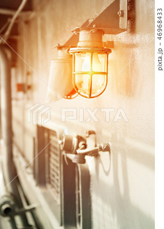 Deck lamp on ship in protective cage Deck lamp on ship in protective cage 46968433
