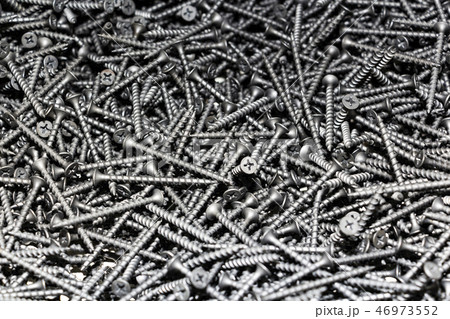 focus on center. black screws texture background focus on center. black screws texture background 46973552