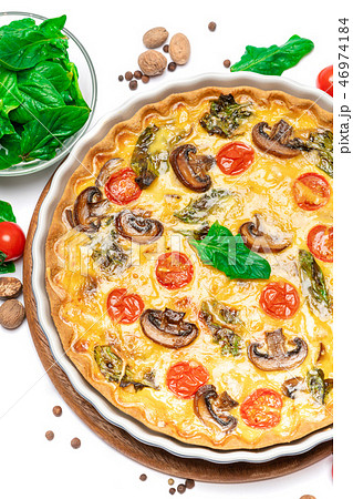 Baked homemade quiche pie in ceramic baking form Baked homemade quiche pie in ceramic baking form 46974184
