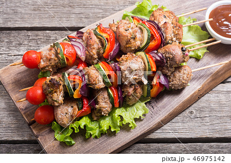 Grilled pork shish or kebab on skewers Grilled pork shish or kebab on skewers 46975142