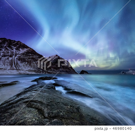 Northen light above mountains and ocean, Norway Northen light above mountains and ocean, Norway 46980140