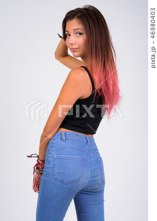 Portrait of young beautiful woman against white background Portrait of young beautiful woman against white background 46980403