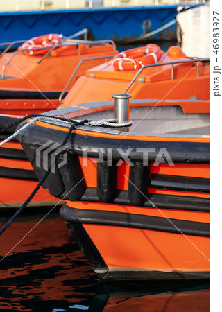 Orange and black boats moored in the port - Italy Orange and black boats moored in the port - Italy 46983927